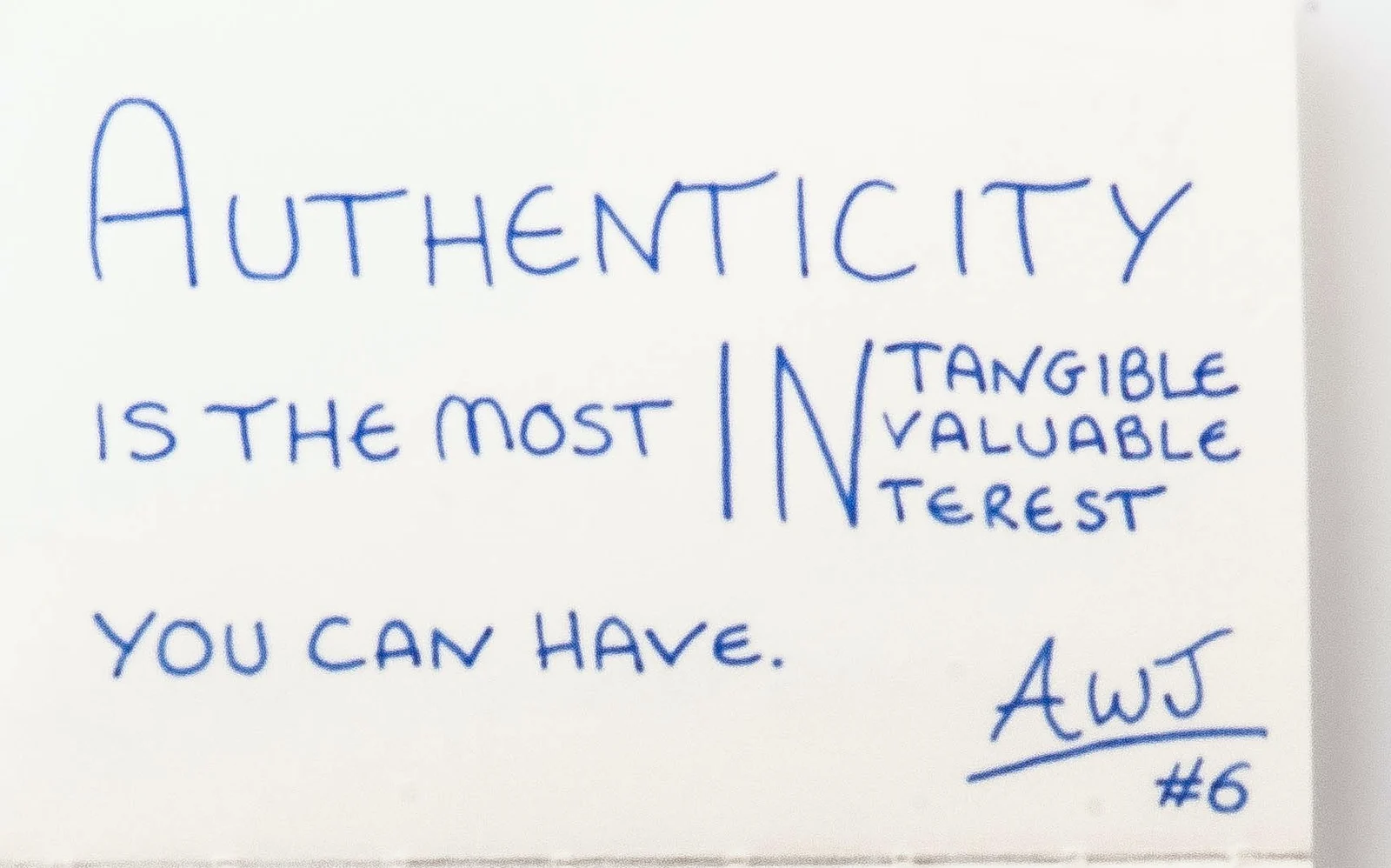Handwritten in blue ink: Authenticity is the most intangible, invaluable interest you can have, with the three IN words stacked. Signed AWJ, number 6.